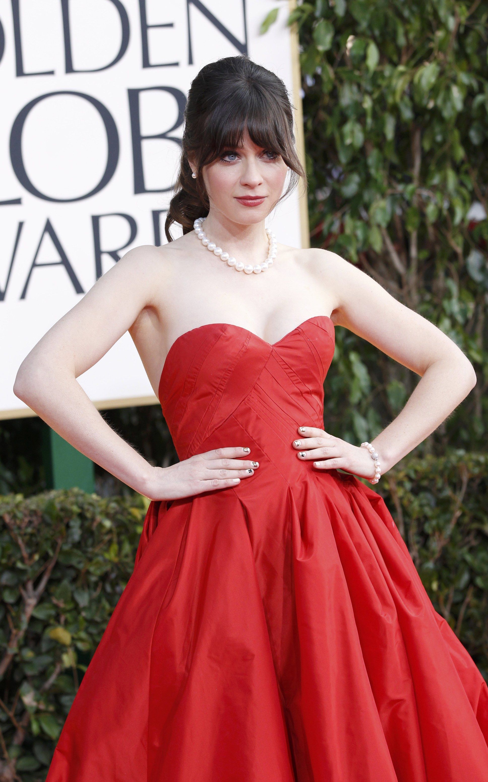 Actress Zooey Deschanel arrives at the 70th annual Golden Globe Awards in Beverly Hills